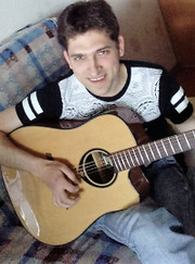 Преподаватель музыки, преподаватель по игре на гитаре Алексей Константинович Волков